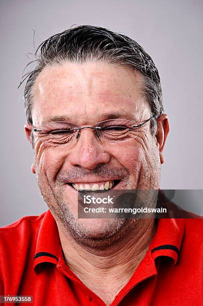 Portrait Of Person With Happy Smile With A Grey Background Stock Photo - Download Image Now