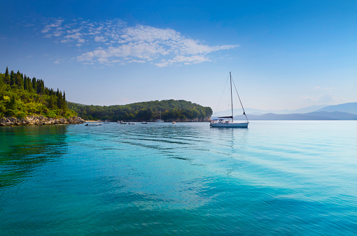 Sail yacht on Agni bay on the North-East of Corfu island.