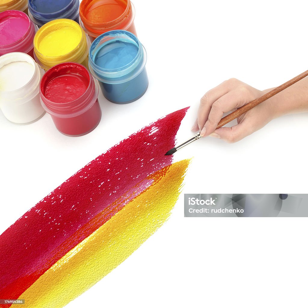 hand with brush and paint Paint Can Stock Photo