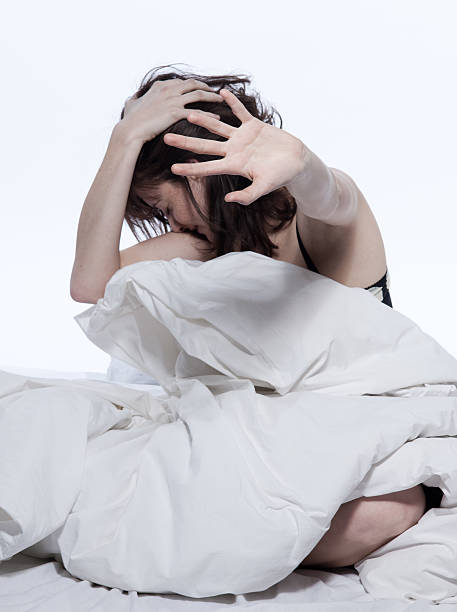 istock woman in bed awakening sukllen sulk hiding 176954569
