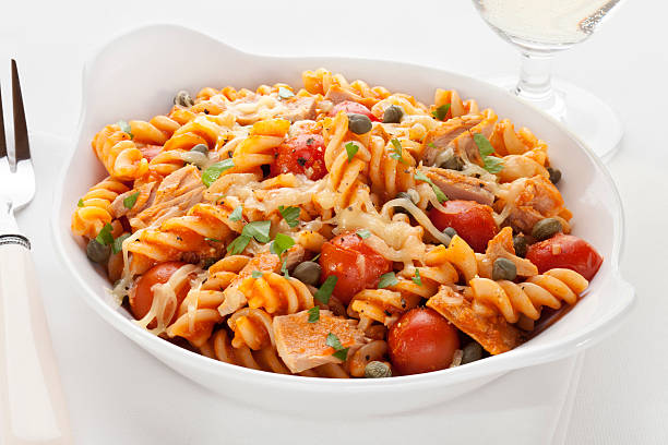 Pasta Bake with Tuna and Tomatoes "Fusili pasta baked with tuna, cherry tomatoes, marinara, capers and mozzarella. For more of my pasta images, please click" pasta casserole stock pictures, royalty-free photos & images