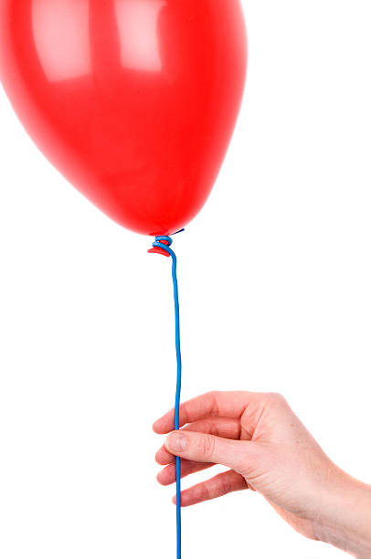 istock Woman's Hand Holding A Balloon 176957247