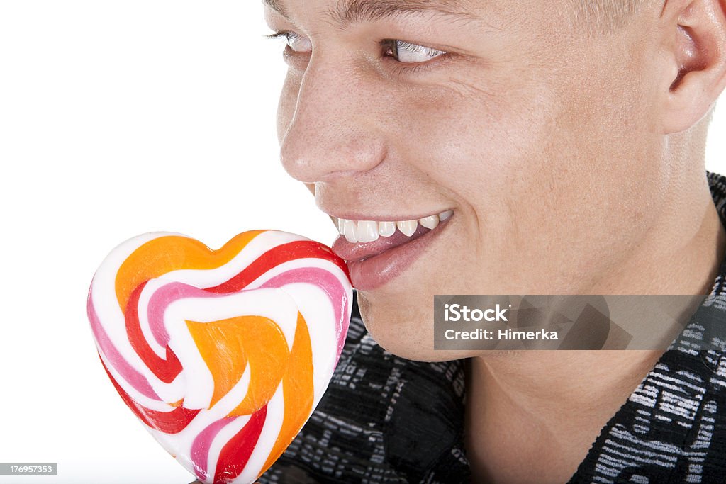 Der junge Mann lecken eine lollypop - Lizenzfrei Dating Stock-Foto