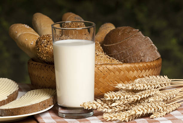 milk with bread taken under studio light with electronic flash bread bun corn bread basket stock pictures, royalty-free photos & images