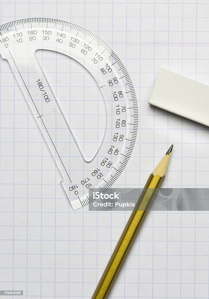 Pencil, an eraser and a ruler "A pencil, an eraser and a ruler on the exercise book" Abstract Stock Photo