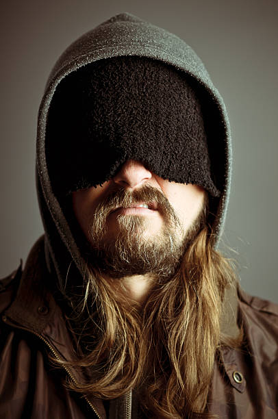 istock Sneering Man Blinded By His Own Knit Hat 176959471