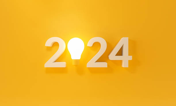 istock Bulb light with new year 2024 on yellow background. 1769597818