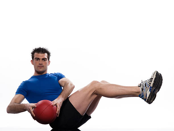 istock man holding fitness ball Workout Posture exercise 176959935