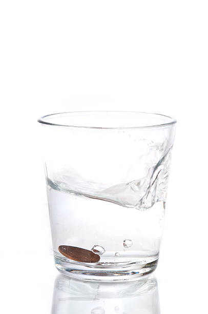 istock Glass of water with a coin 176960488