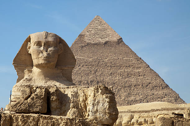 sphinx and pyramid at giza stock photo