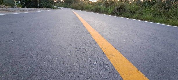 istock yellow marking lines on an asphalt road 1769606804