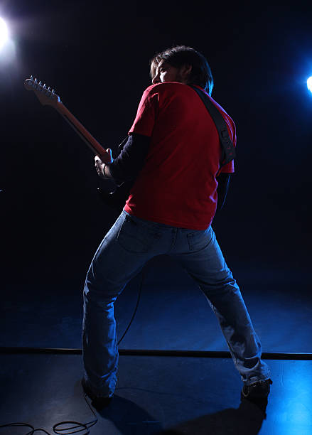 istock Musician playing electric guitar on stage 176961548