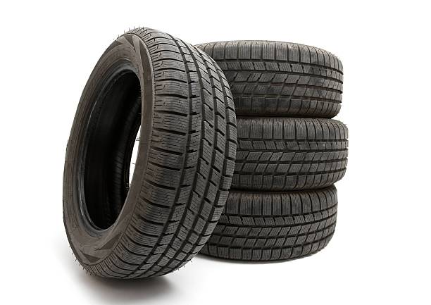 istock 4 big black tires isolated on white 176961611