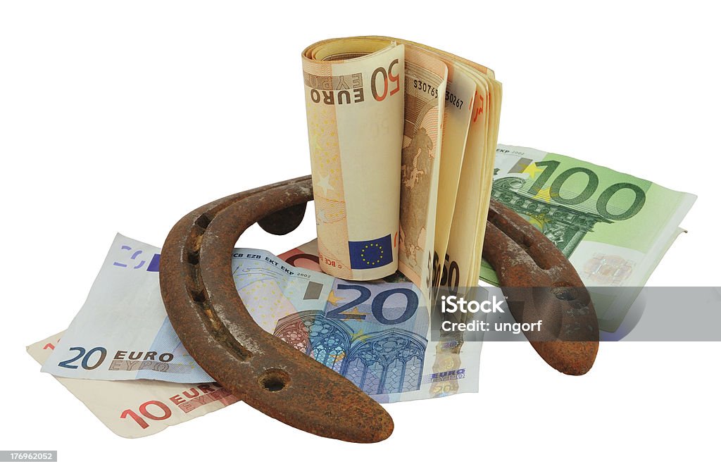ホースシューとお金 - ユーロ貨幣のロイヤリティフリーストックフォト