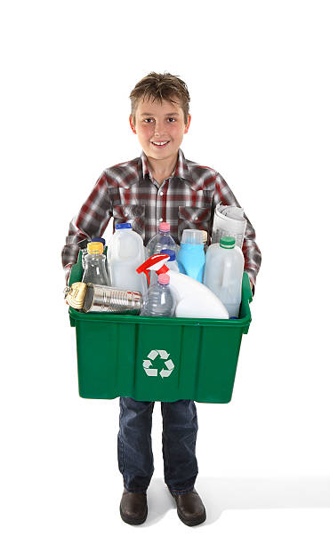 istock Boy holding recycling bin full or rubbish 176962292