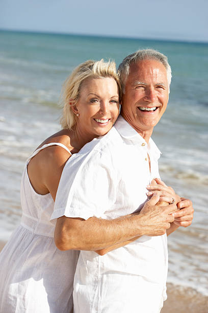 istock Senior Couple Enjoying Beach Holiday 176962319