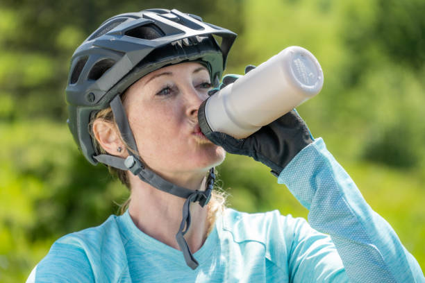 istock Woman in helmet drinking water 1769626892