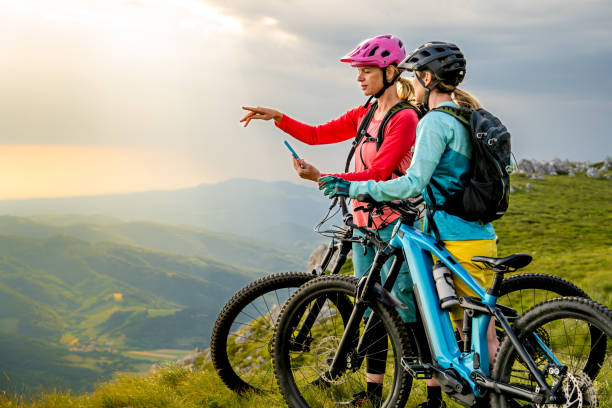 istock Female cyclists taking break while riding bike 1769626902