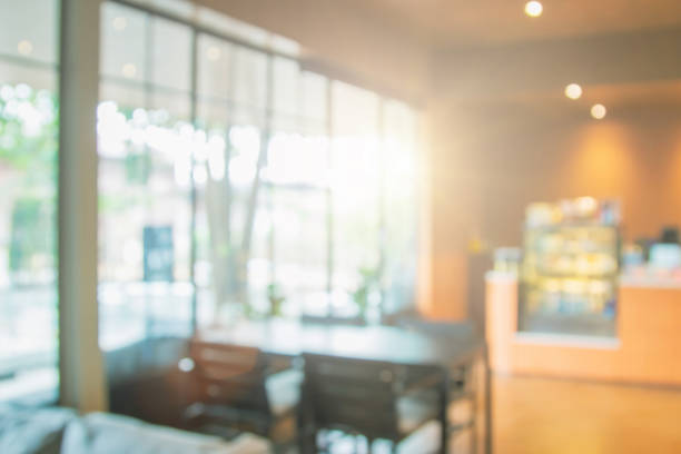 istock Abstract blur interior coffee shop or cafe for background. Blur restaurant interior banner background. Coffee shop blur background with bokeh. Blurred windows green garden background. 1769628129