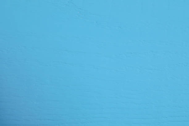 Texture of light blue wooden surface as background, closeup