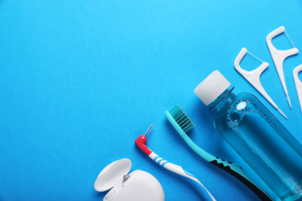 istock Dental floss and different teeth care products on light blue background, flat lay. Space for text 1769639007