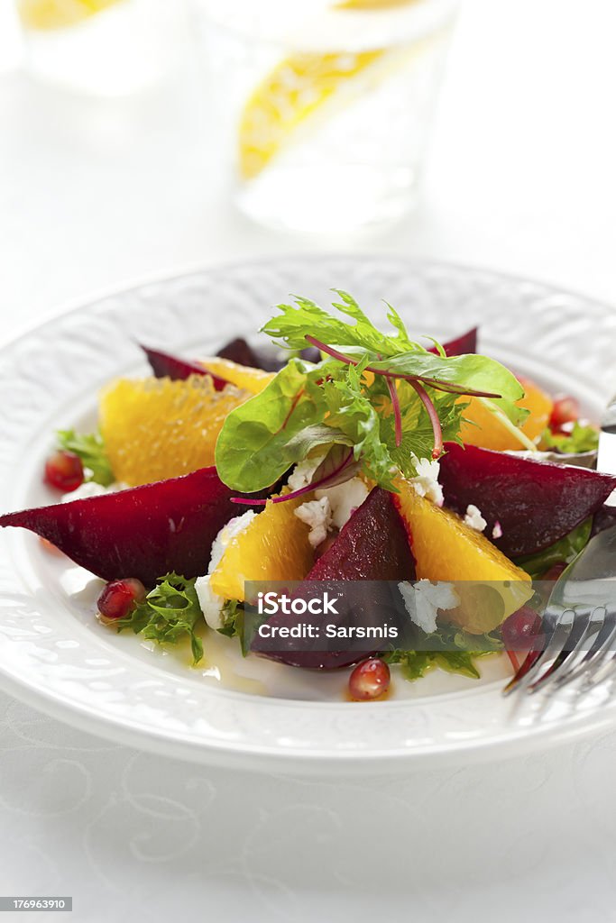 beetroot salad "salad of beetroot,goat cheese,orange and pomegranate" Appetizer Stock Photo