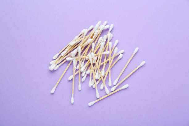 istock Wooden cotton buds on violet background, flat lay 1769639428