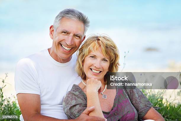 Mature Couple Smiling Stock Photo - Download Image Now - Active Seniors, Adult, Adults Only