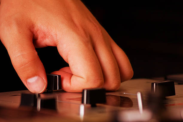 istock Hand of a dj adjusting the crossfader 176965681