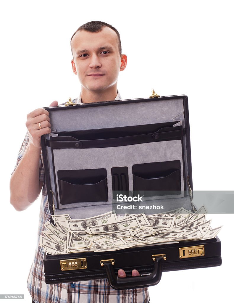 Giovane uomo con la valigia piena di denaro - Foto stock royalty-free di Aprire