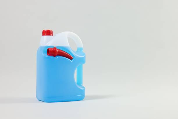 istock Plastic canister with nozzle and blue liquid on light grey background, space for text 1769658322