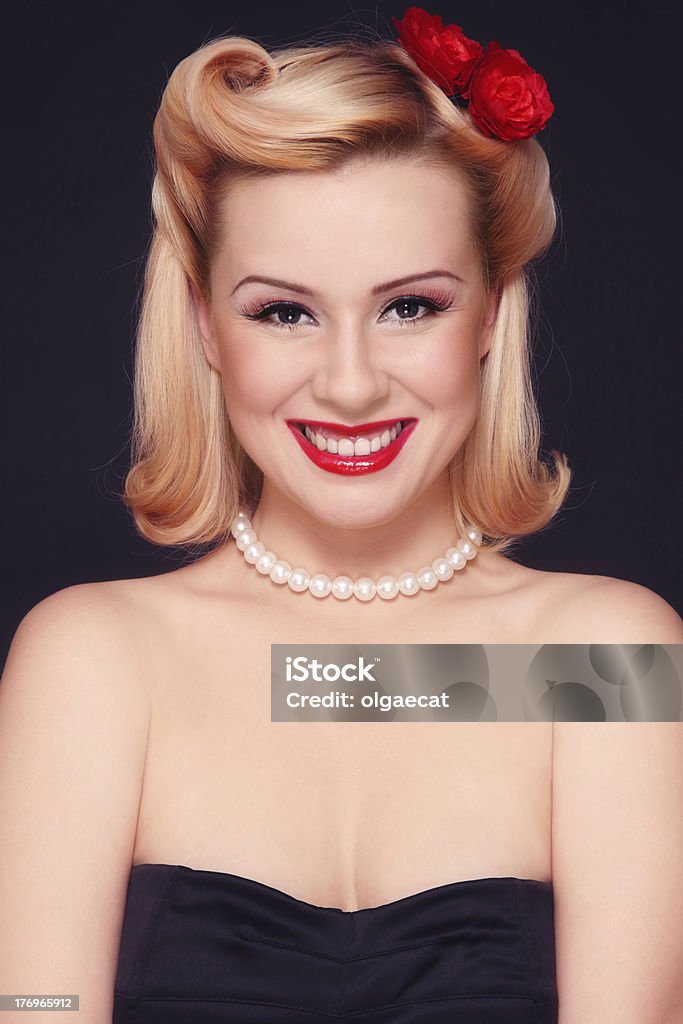 Pin-up girl Beautiful young sexy laughing woman with vintage make-up and hairstyle 1940-1949 Stock Photo