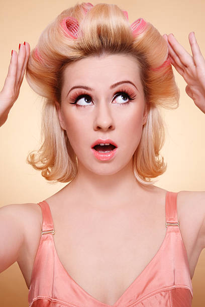 istock Girl in hair-curlers 176965913