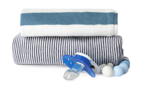 istock Clothes and baby pacifier isolated on white 1769660661