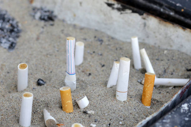 istock Cigarettes and ash on dirty sand in trash tray 1769665867