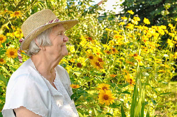 istock Older woman in flowers. 176966596