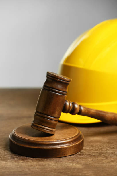 istock Construction and land law concepts. Gavel and hard hat on wooden table 1769666949