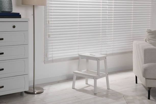 istock White compact ladder near window at home 1769667997