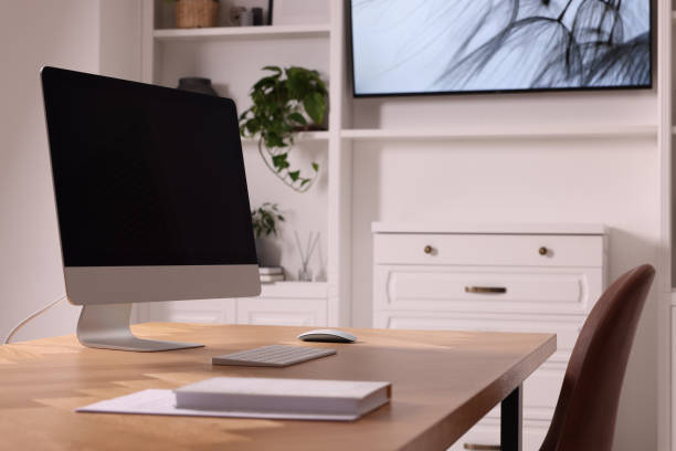 istock Interior design. Cosy workplace with computer near tv area 1769668000