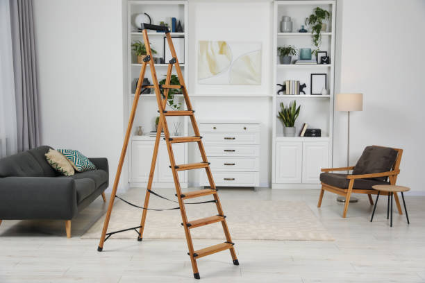 istock Wooden folding ladder on soft carpet in stylish room 1769669049