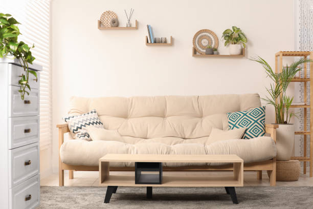 istock Stylish living room interior with comfortable sofa and side table 1769669077