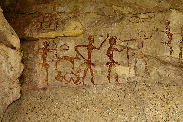 Archeological pre-historic human clift paint Archeological pre-historic human clift paint over 4000 years ago, Nakhonratchasima, Thailand. cave painting photos stock pictures, royalty-free photos & images