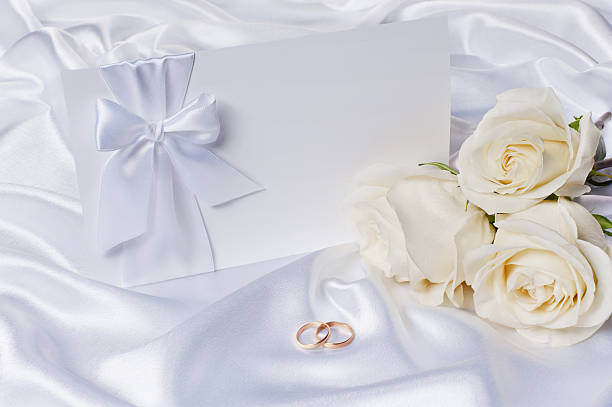 istock Wedding rings with a roses and invitation 176967670