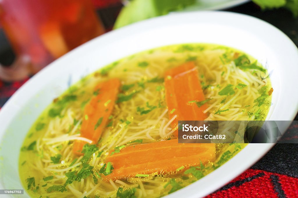Fresh broth with carrot and parsley Appetizer Stock Photo
