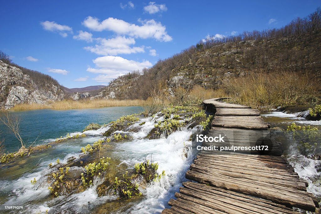 plitvice pathway Wooden pathway over the falls at plitvice lakes in croatia Lake Stock Photo