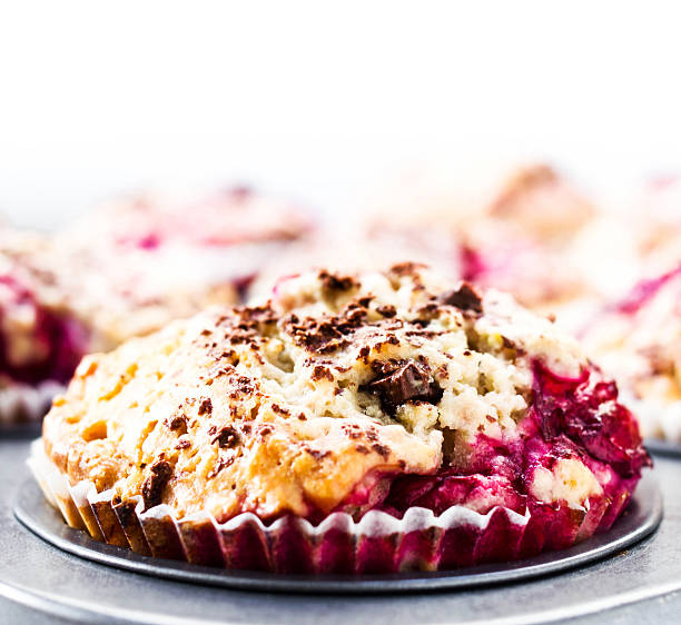 istock Berry muffins with chocolate sprinkles in baking tray. Closeup. 176976347
