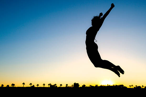 istock Woman Silhouette Jumping 176976480