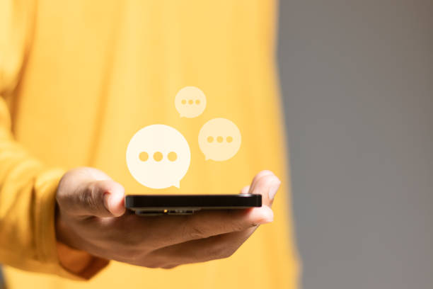 istock Social media marketing concept. Man using smartphone to chat online with chat box icon appearing. 1769769810