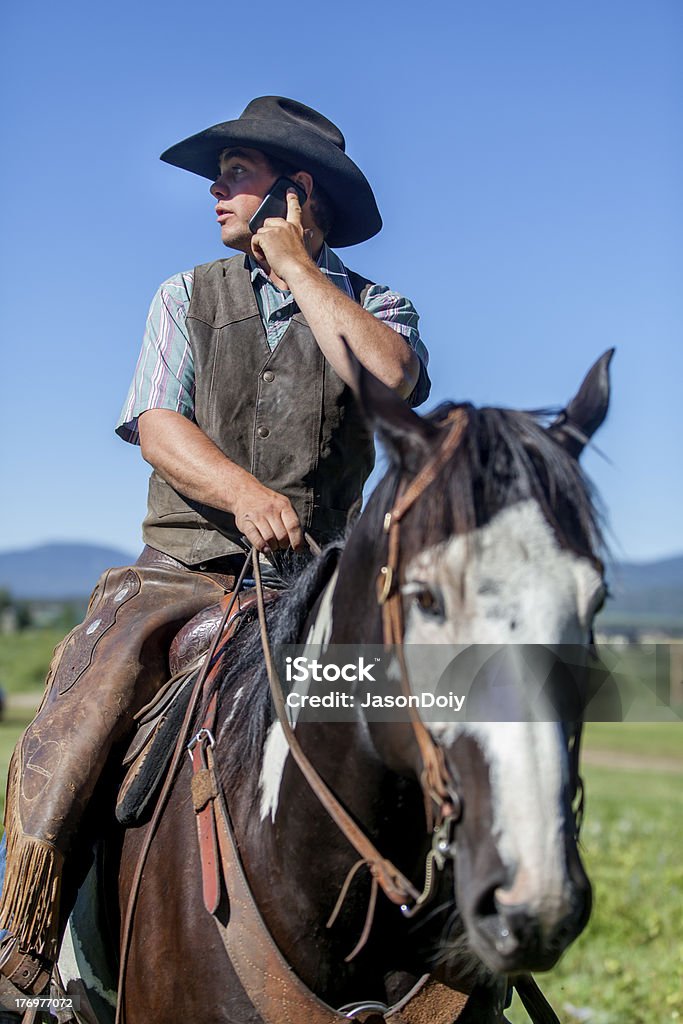 Handy-Cowboy - Lizenzfrei Am Telefon Stock-Foto