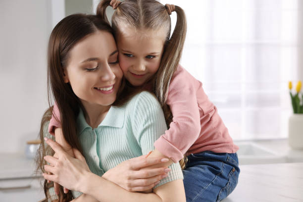 istock Happy mother with her cute daughter in kitchen 1769773069